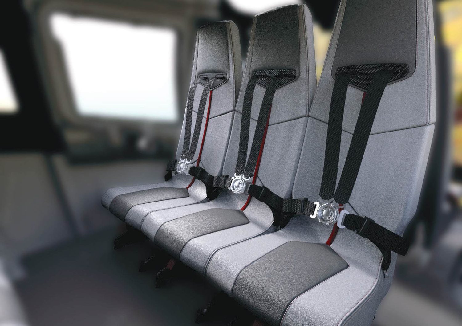 Row of grey seats with four-point harnesses inside a cabin